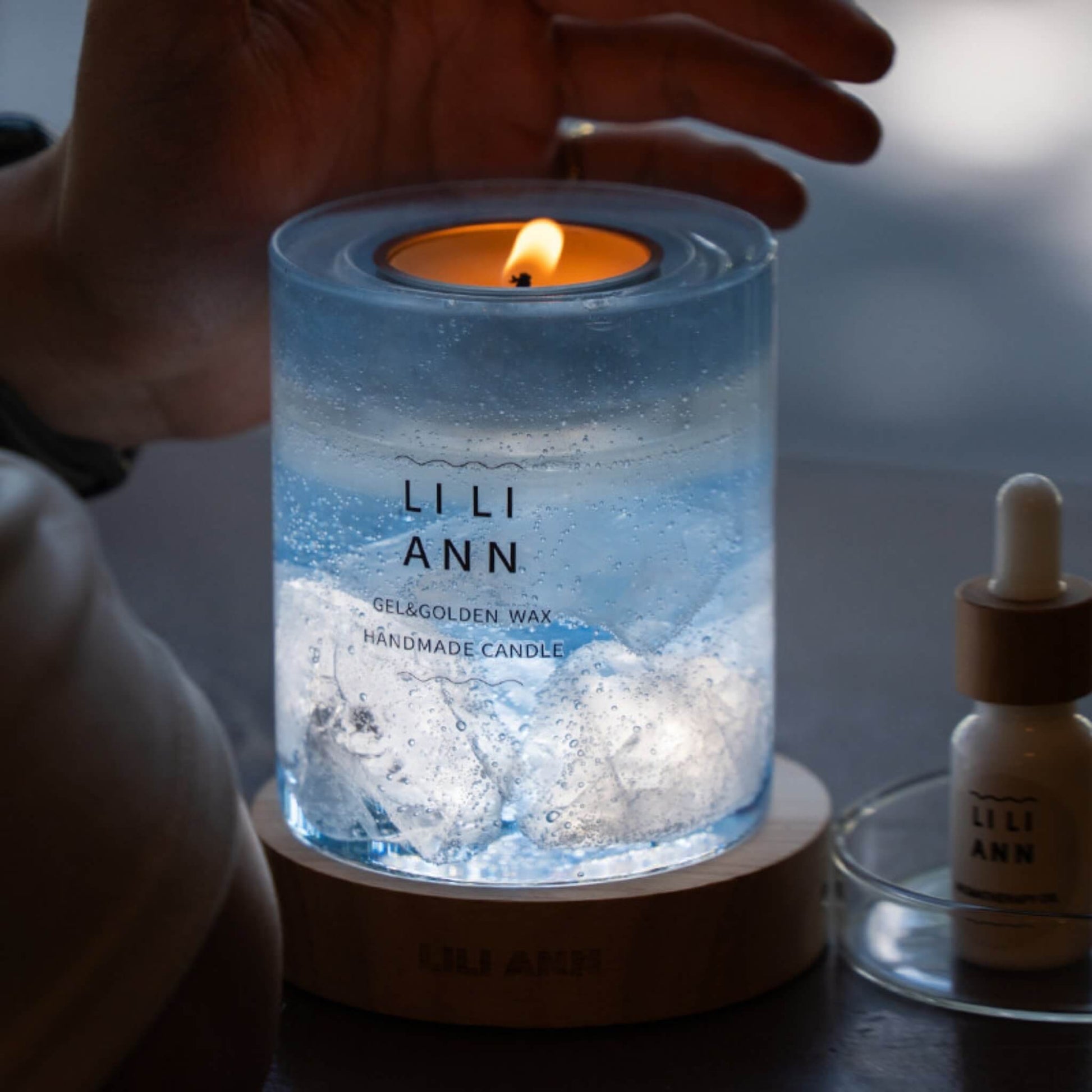 Holding The Gel Object .05 in low light. The flame illuminates the suspended ice structures, creating a cold, blue glow.