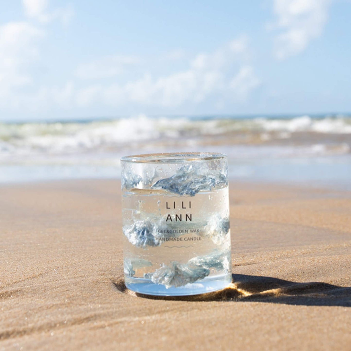 The Gel Object .03 placed on sand by the ocean. A fragment of atmosphere capturing the clarity of sea air.