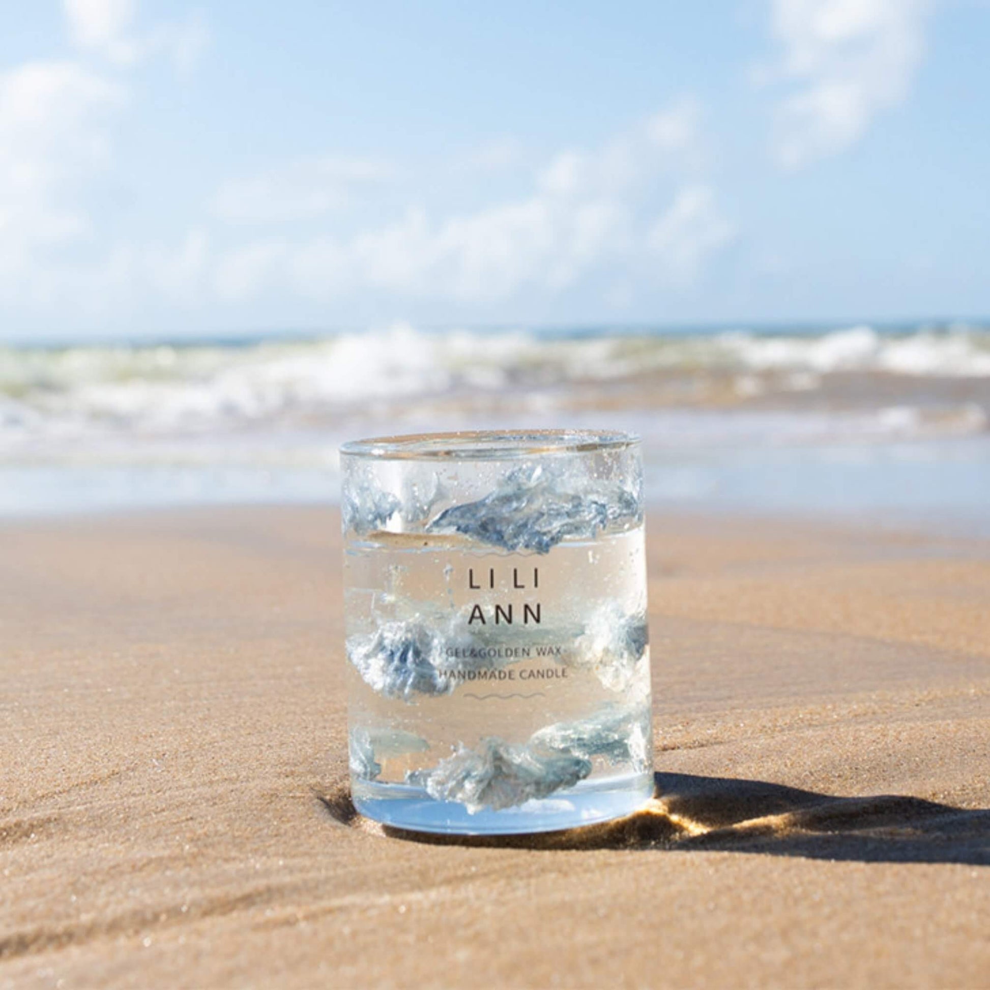 The Gel Object .03 placed on sand by the ocean. A fragment of atmosphere capturing the clarity of sea air.