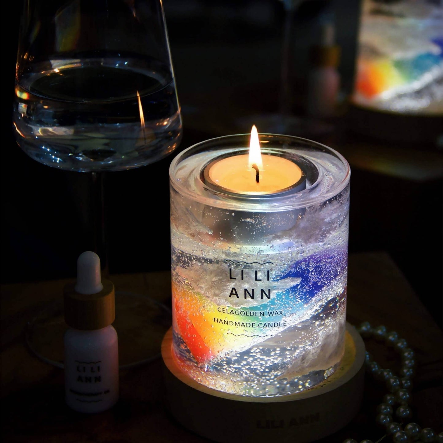 Illuminated Gel Object .04 next to a wine glass, showing the refraction of light through the multi-colored gel layers.