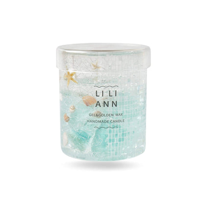 Close-up of iridescent mosaic tiles and marine specimens suspended in bubble-free clear blue gel.