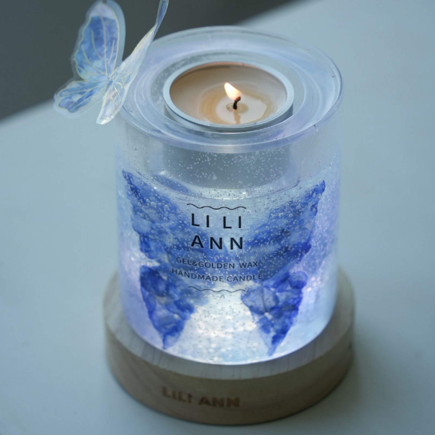 Illuminated Gel Object .01 showing translucent butterfly wings glowing in candlelight.