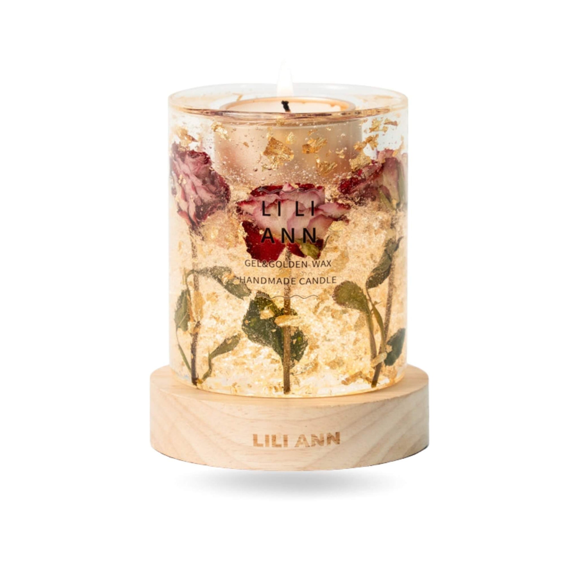 Close-up of clear gel wax containing whole dried roses and suspended gold foil particles.