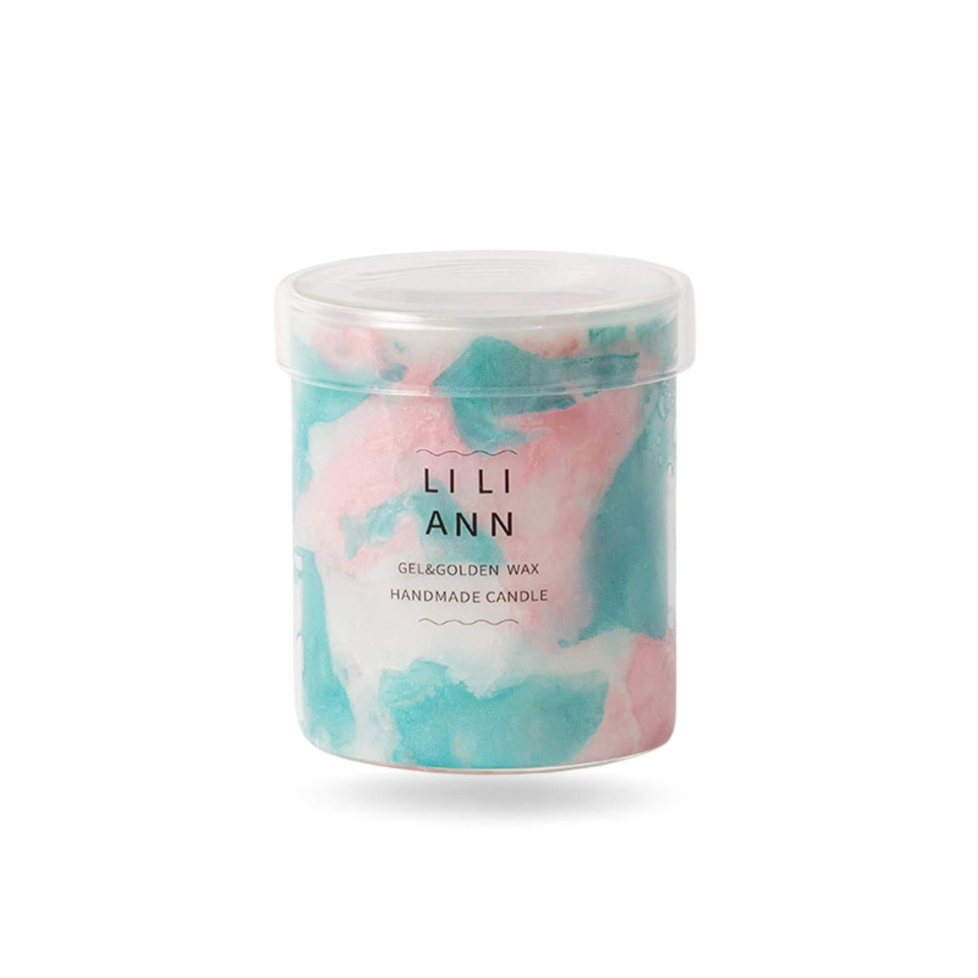 Close-up of clear gel wax with suspended pink lotus and green bamboo inspired pigments.